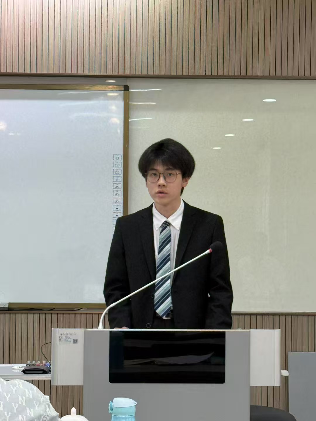 Zhao Wenpu presenting during a business project